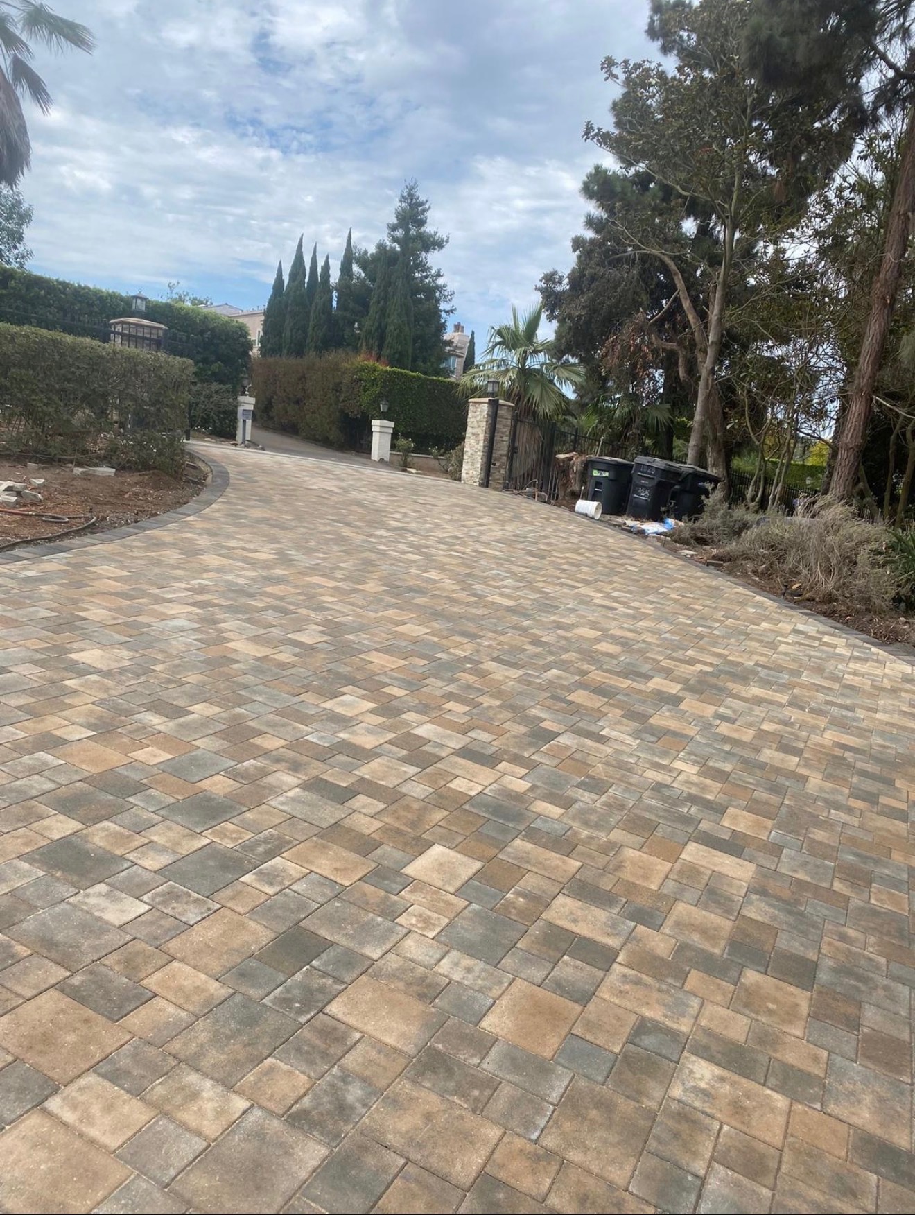 Driveway after — hand-laid stone pavers