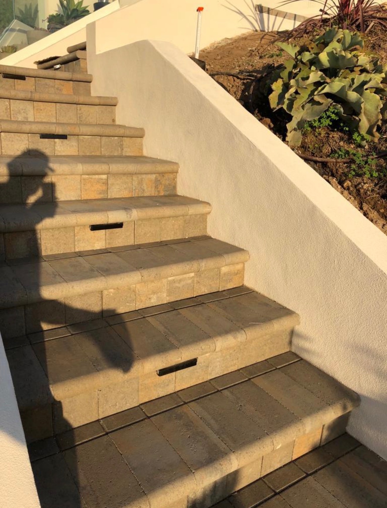 Patio staircase after — finished stone steps with built-in lighting