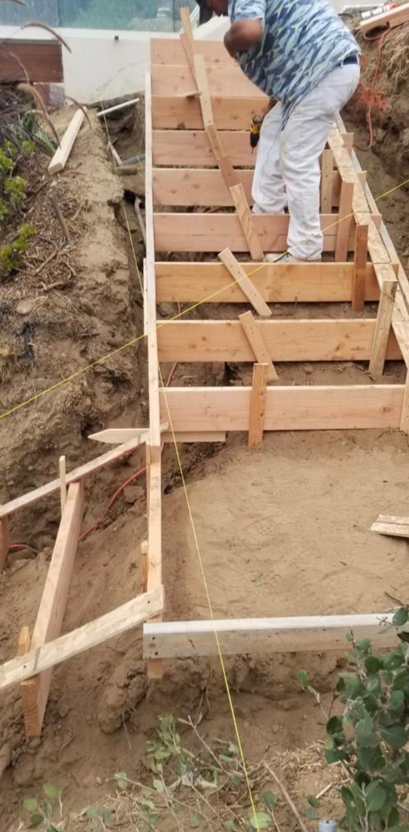 Patio staircase before — wood formwork framing
