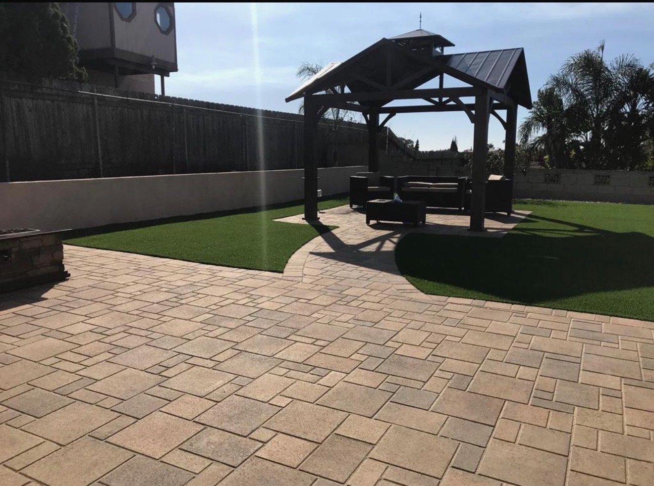 Backyard gazebo paver patio turf
