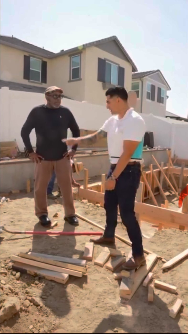 Freedom Design and Remodel team consulting on job site